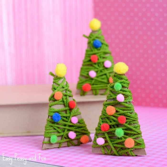 cardboard trees wrapped in green yarn