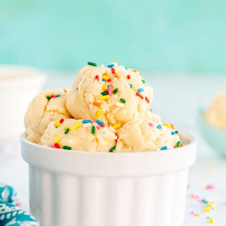 White bowl with edible sugar cookie balls stacked in it