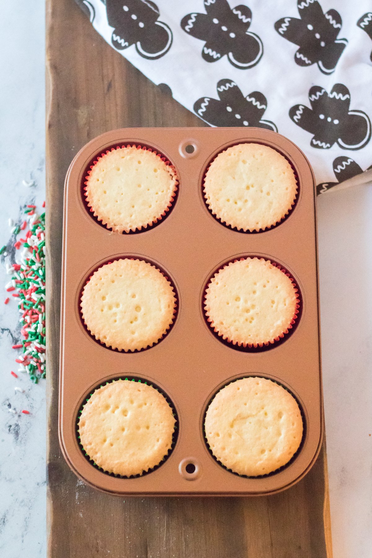 baked pound cake cupcakes in a muffin tin