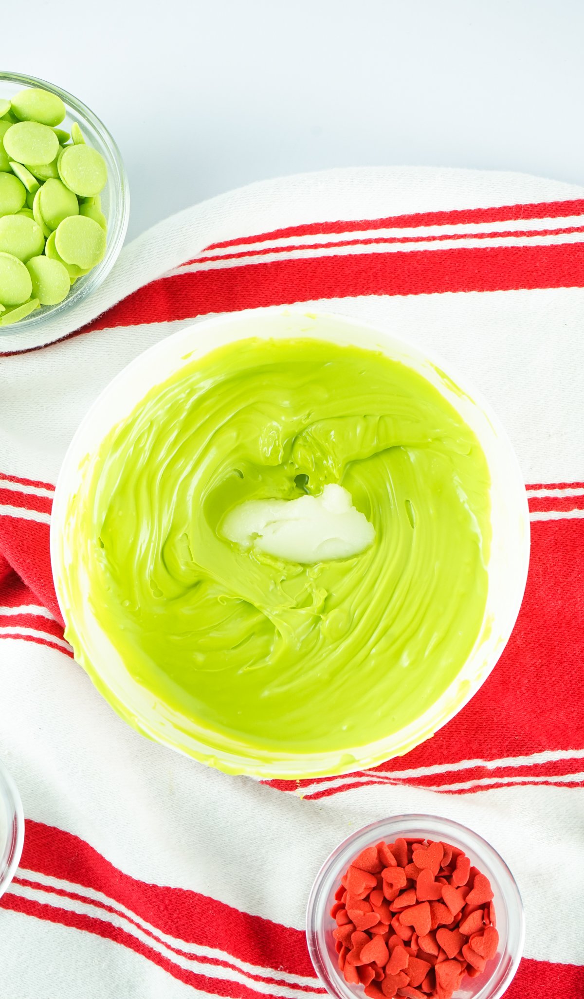 melted vibrant green candy melts in a bowl