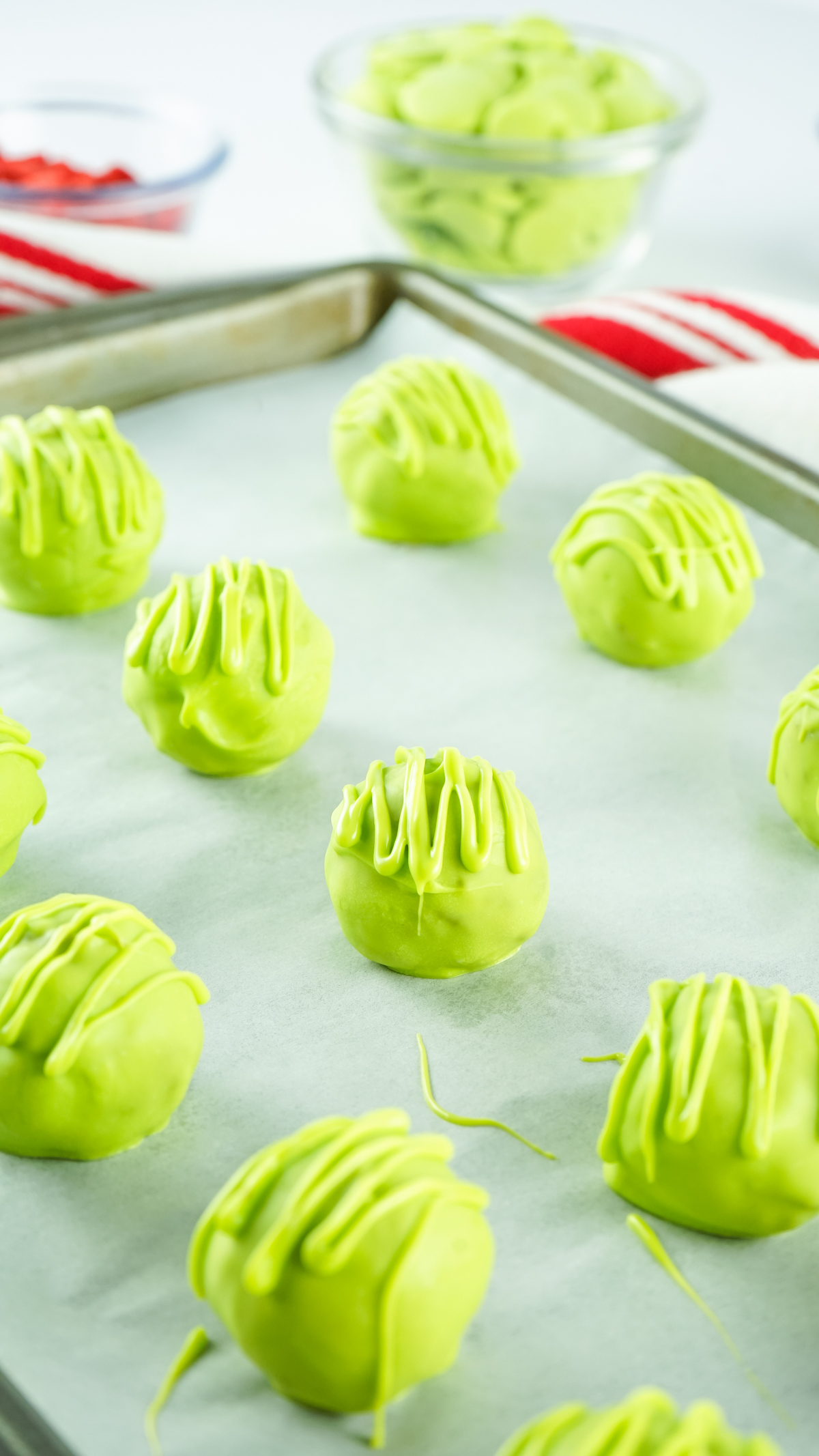 Grinch Christmas balls drizzled with green frosting
