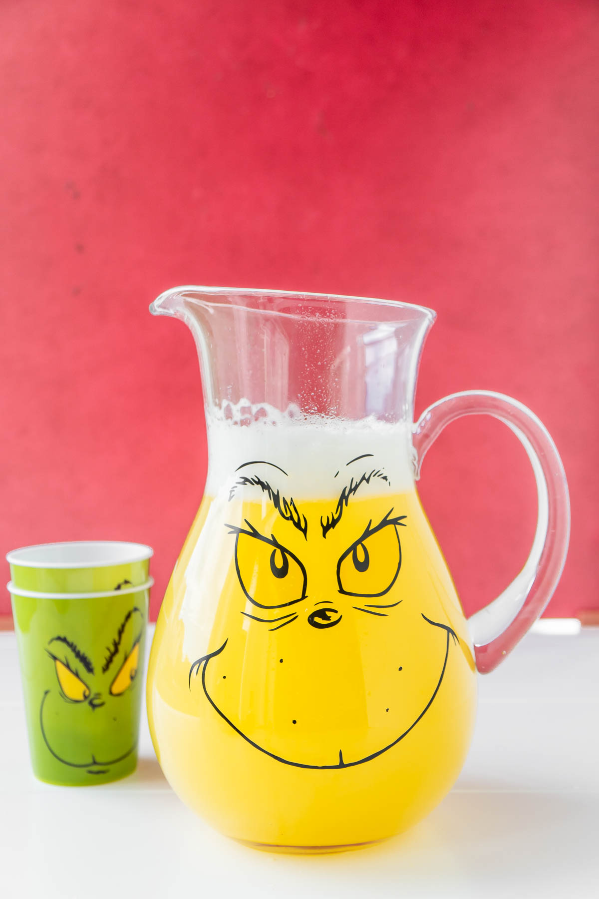 yellow liquid inside a Grinch pitcher