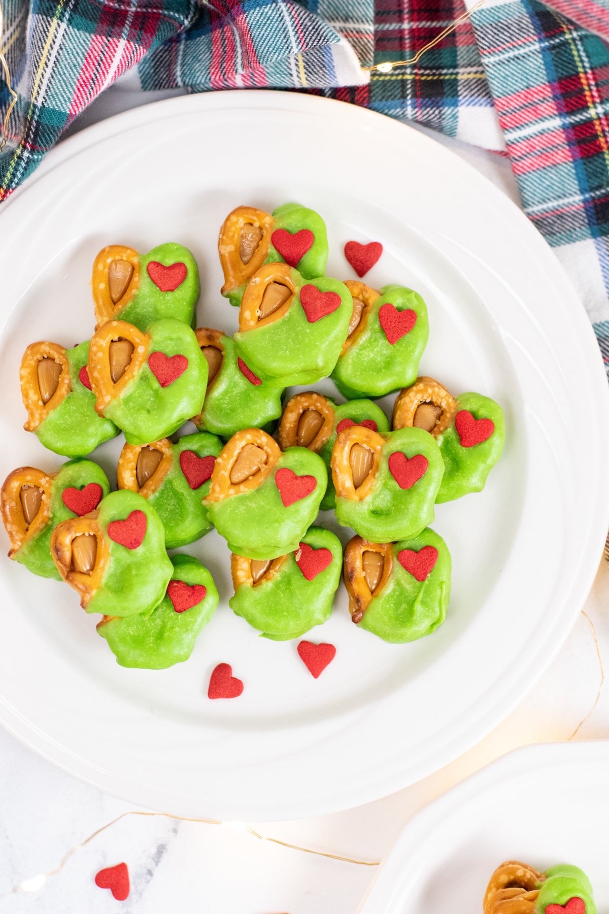 stack of Grinch snacks on a white plate
