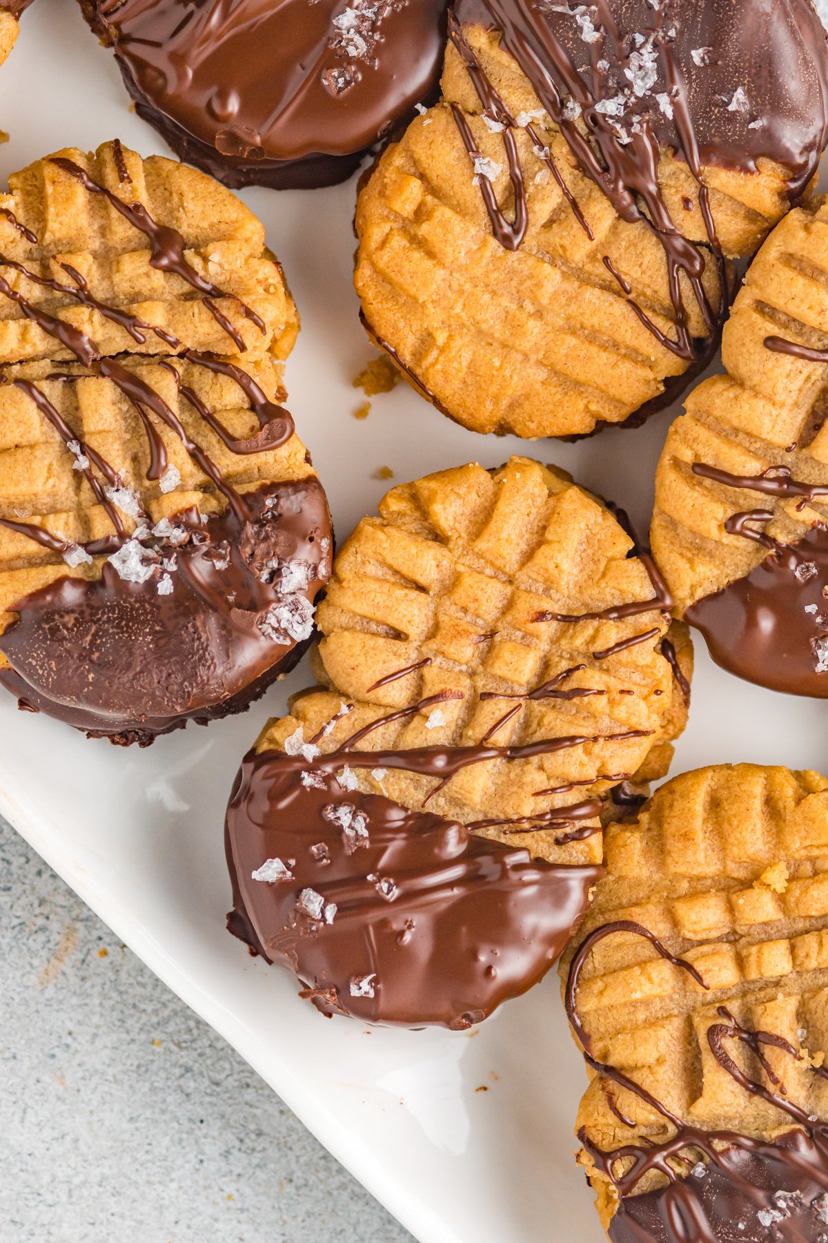 homemade nutter butters dipping in chocolate