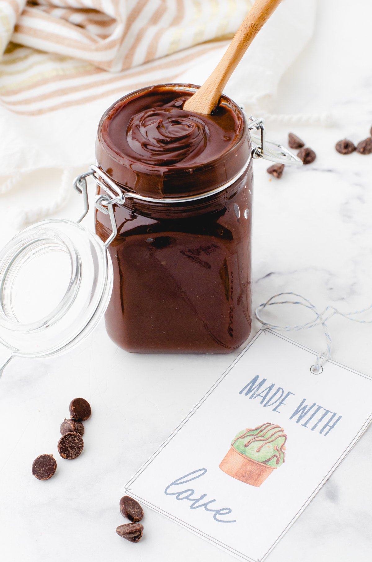 wooden spoon in a jar of homemade hot fudge