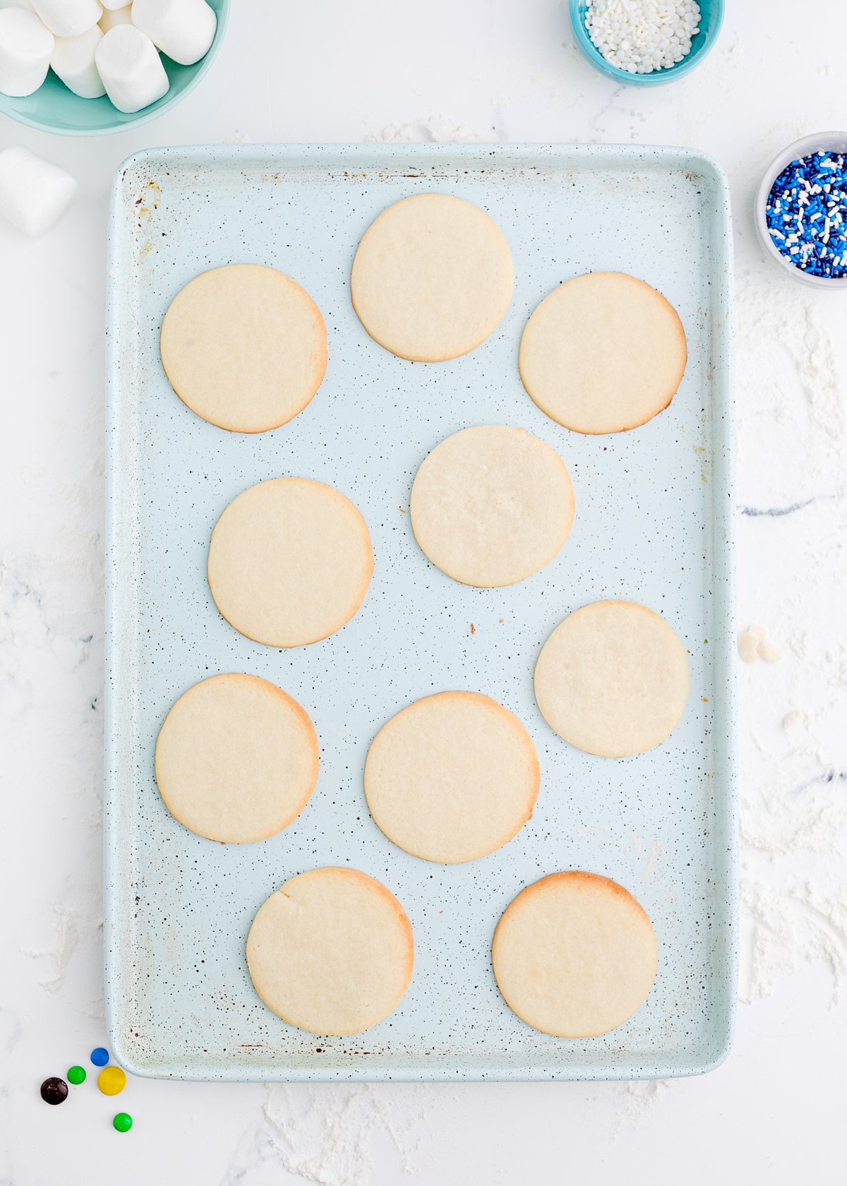 baked sugar cookies on a baking sheet