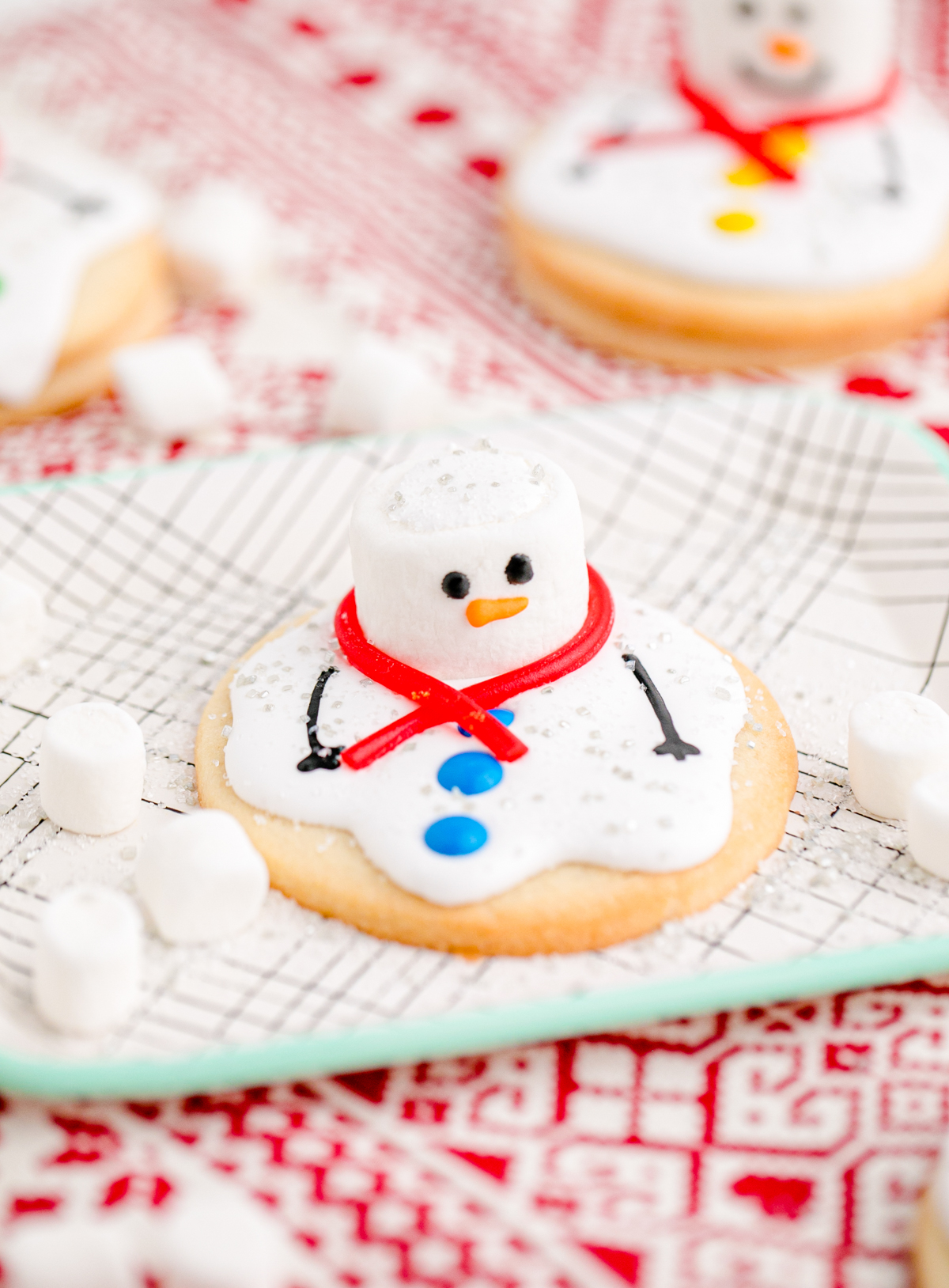 melted snowman cookies on a white plate