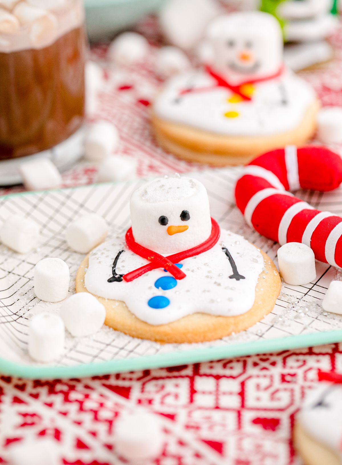 melted snowman cookies with Christmas decorations
