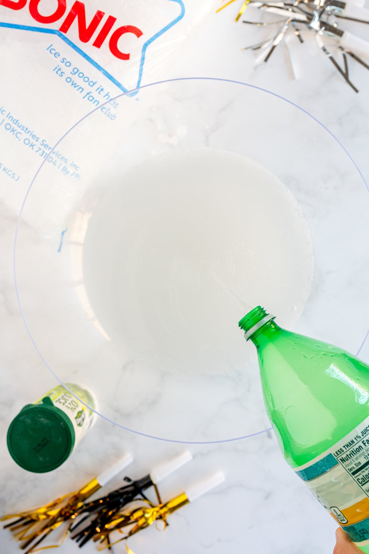 Pouring Fresca in a large punch bowl