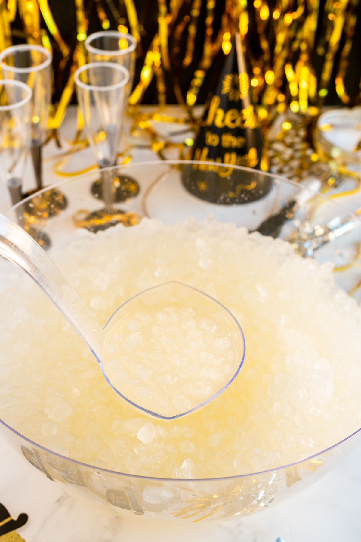 ladle over a punch bowl filled with New Year's Eve punch