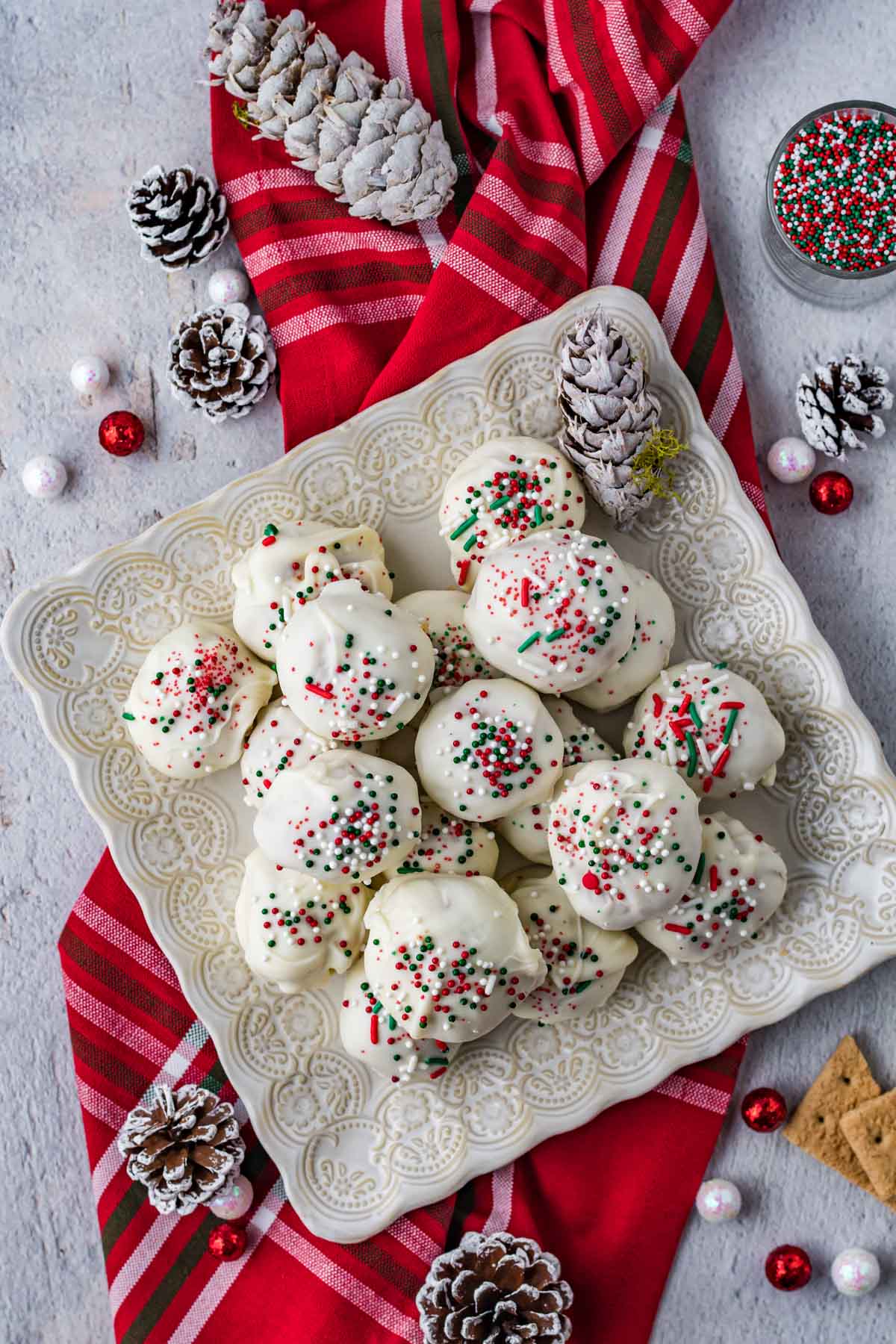 white plate with a pile of peanut butter snowballs