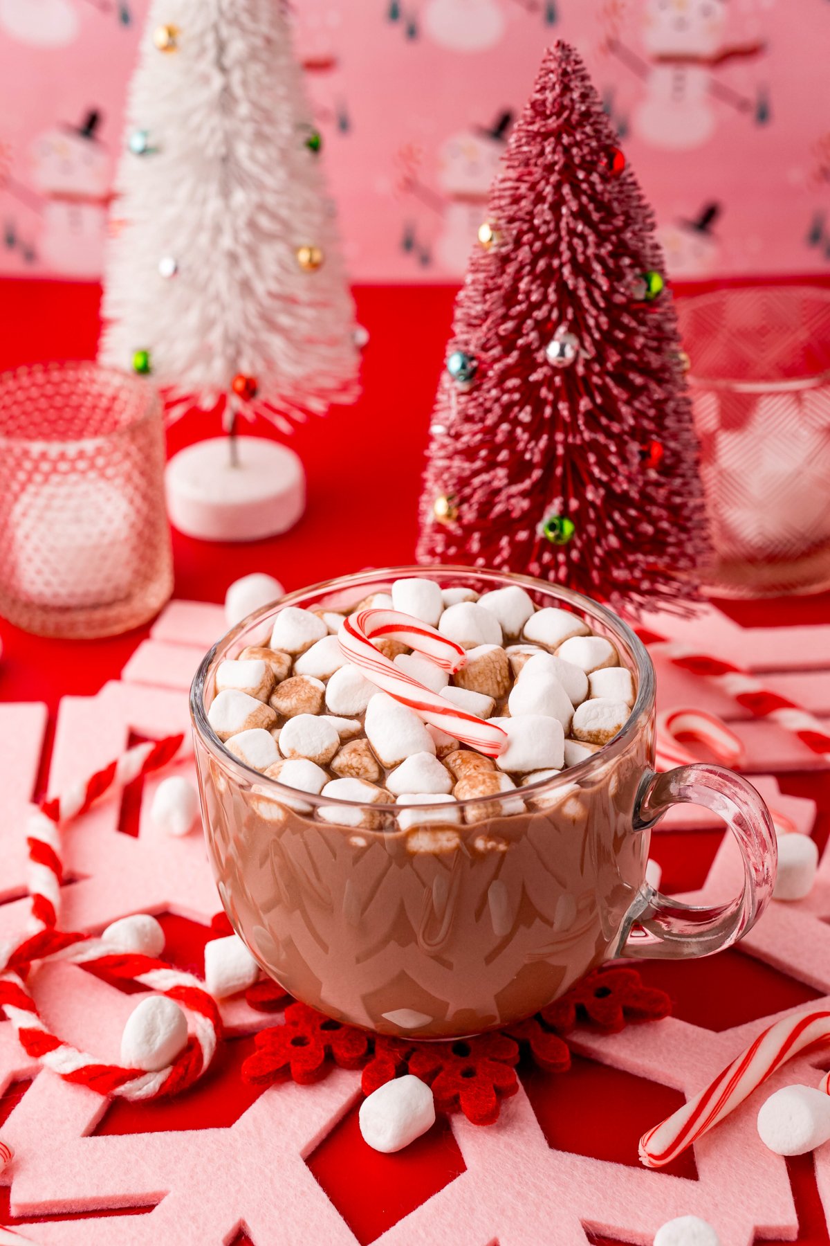 glass mug with peppermint hot chocolate topped with candy canes