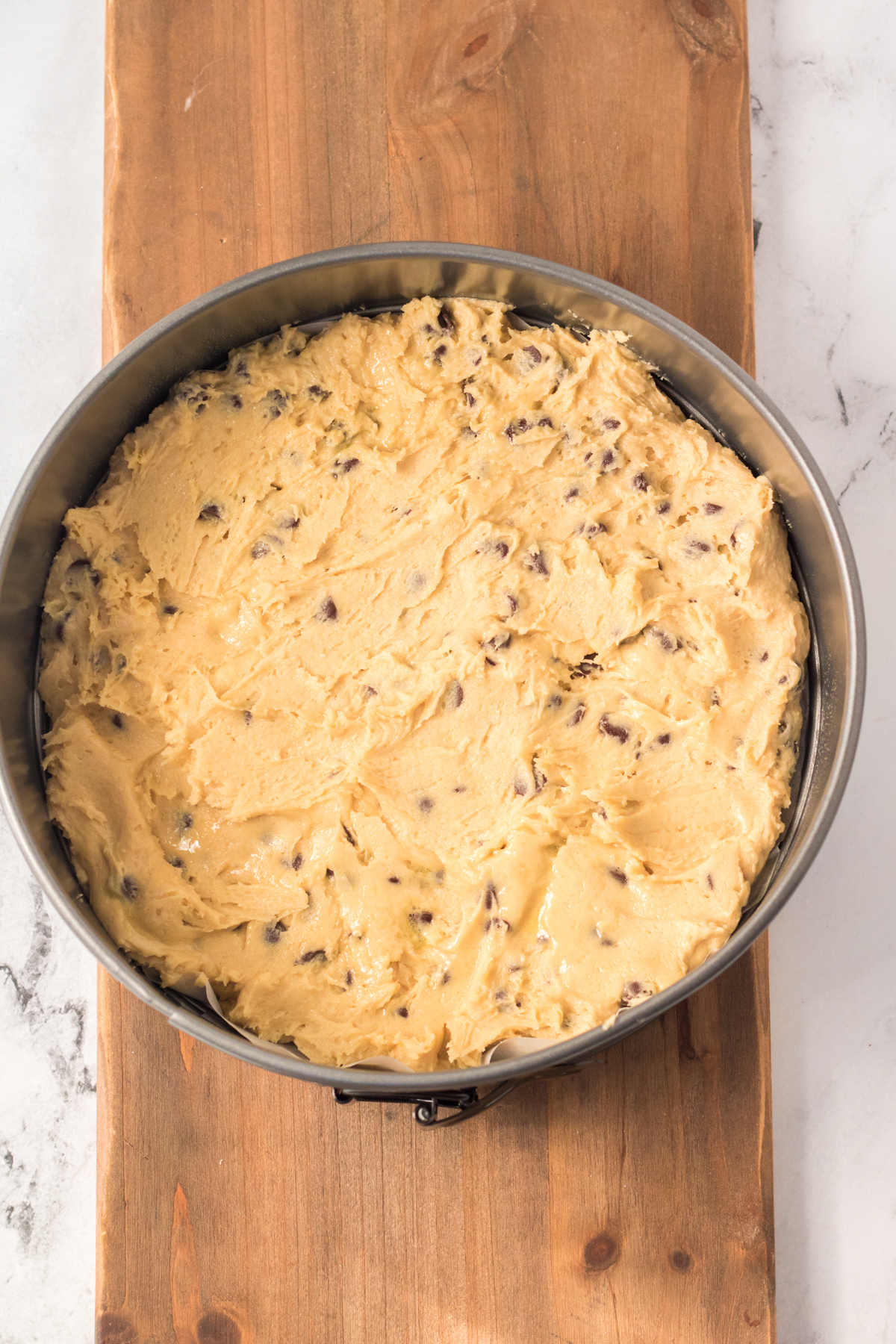 cookie cake dough in a cake pan