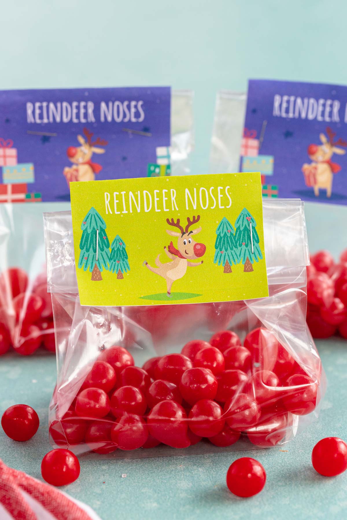 red cherry balls in a bag with a reindeer noses tag