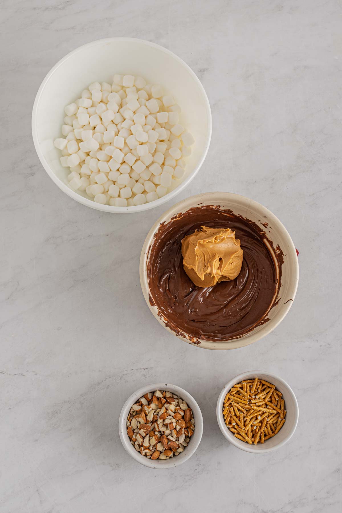 peanut butter in a bowl of melted chocolate