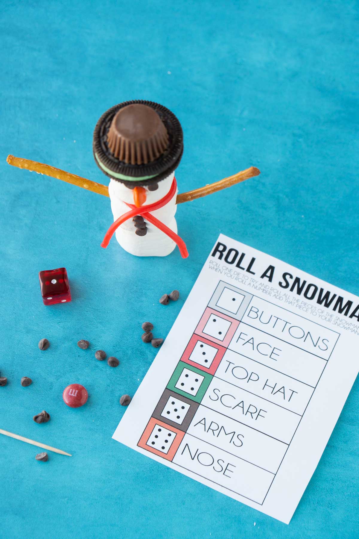 a marshmallow snowman and roll a snowman playing cards