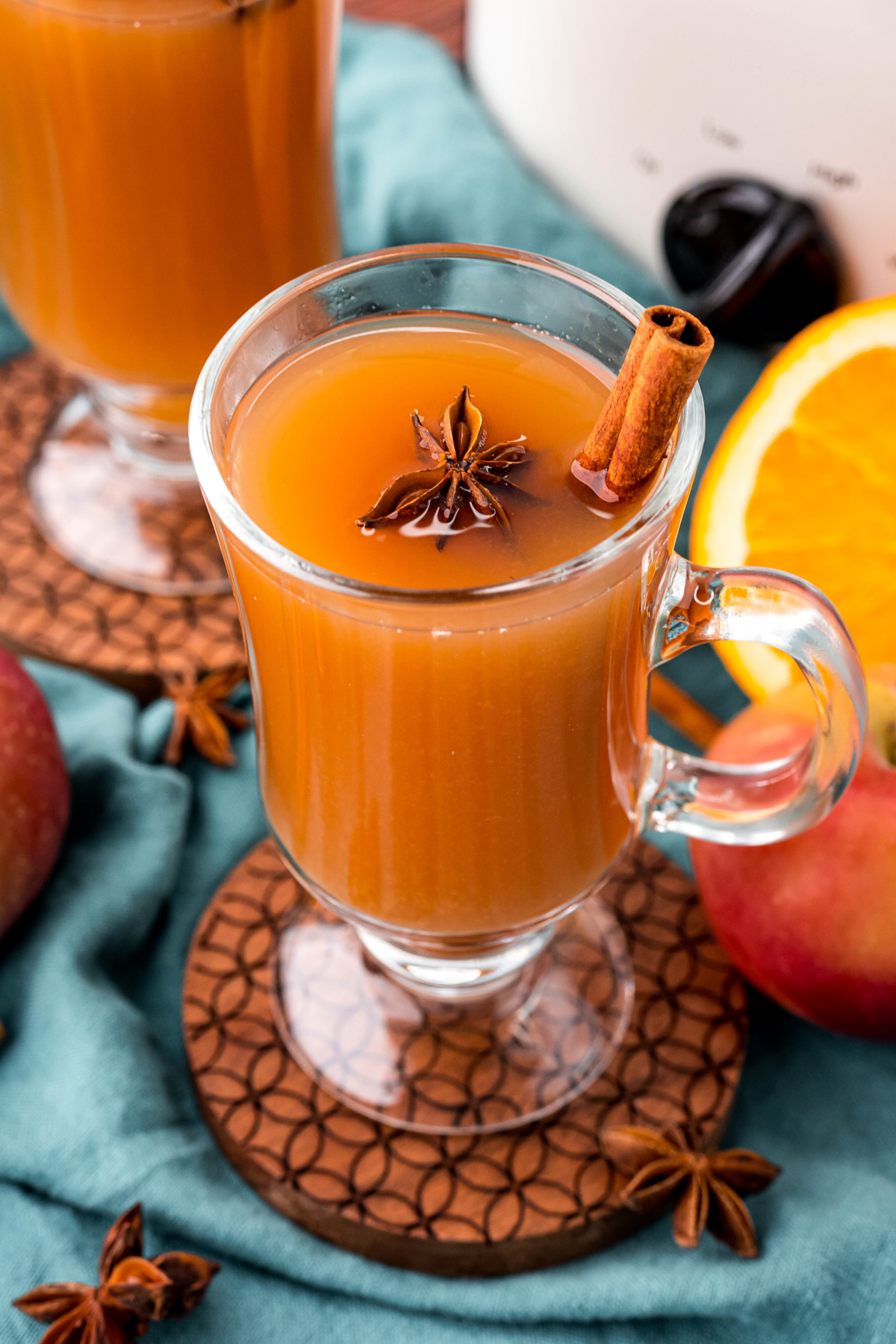 glass mug of wassail with anise on top
