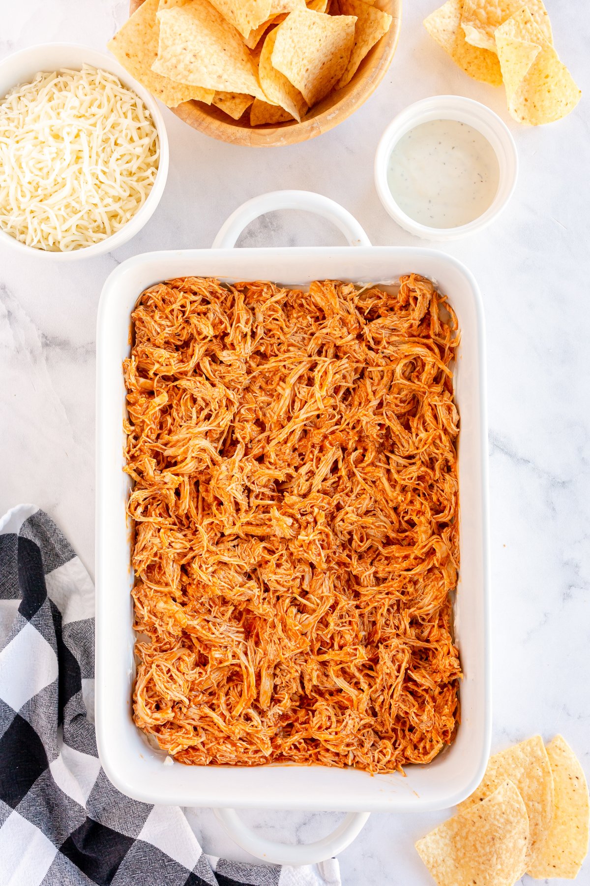 buffalo chicken in a white baking dish