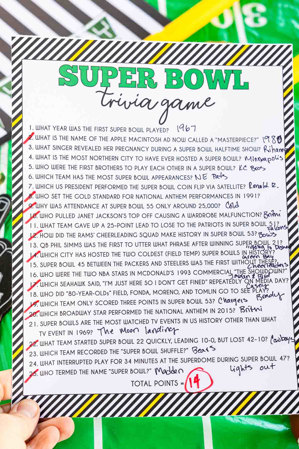 Super Bowl trivia game with answers written in