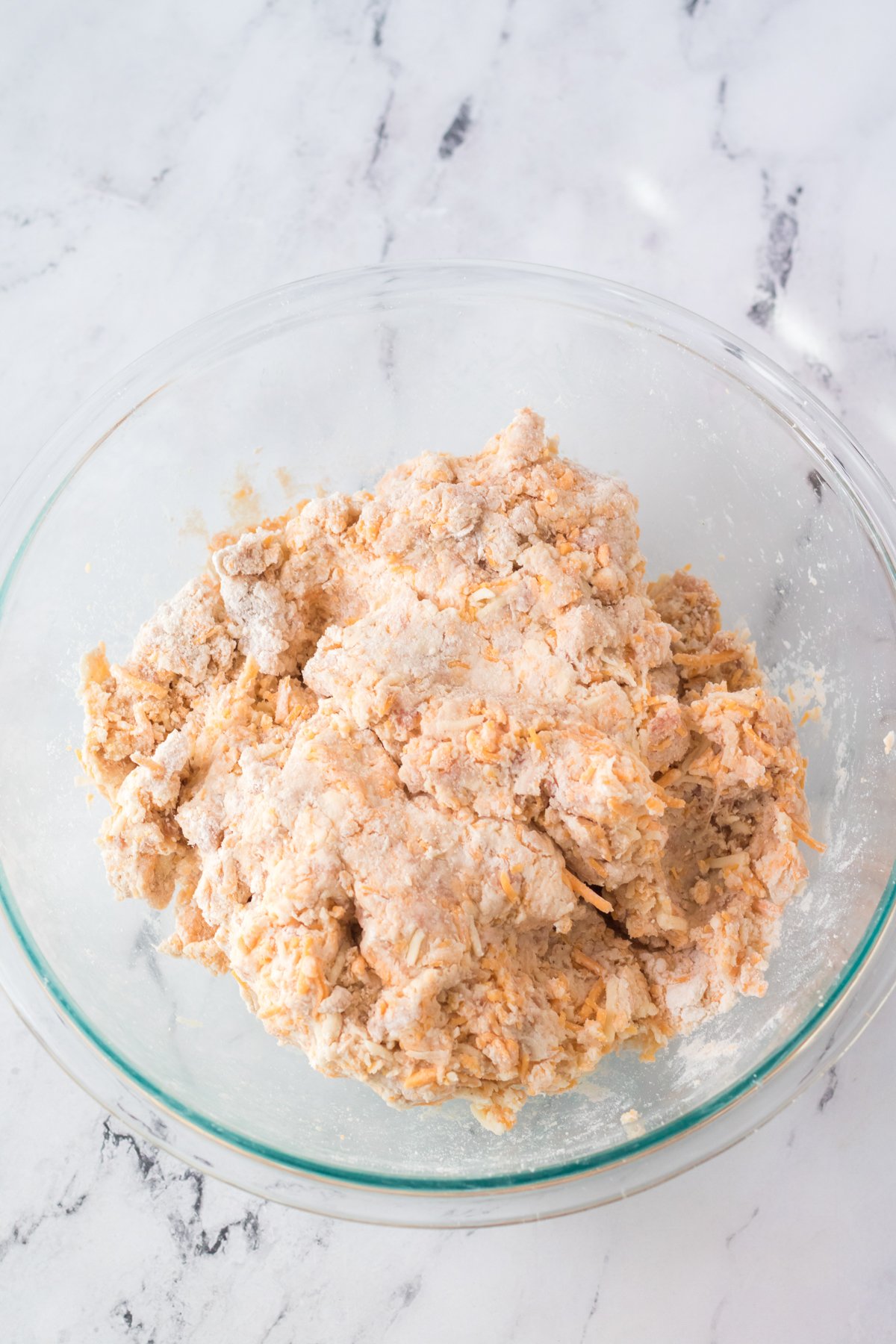 mixture for sausage balls in a glass bowl