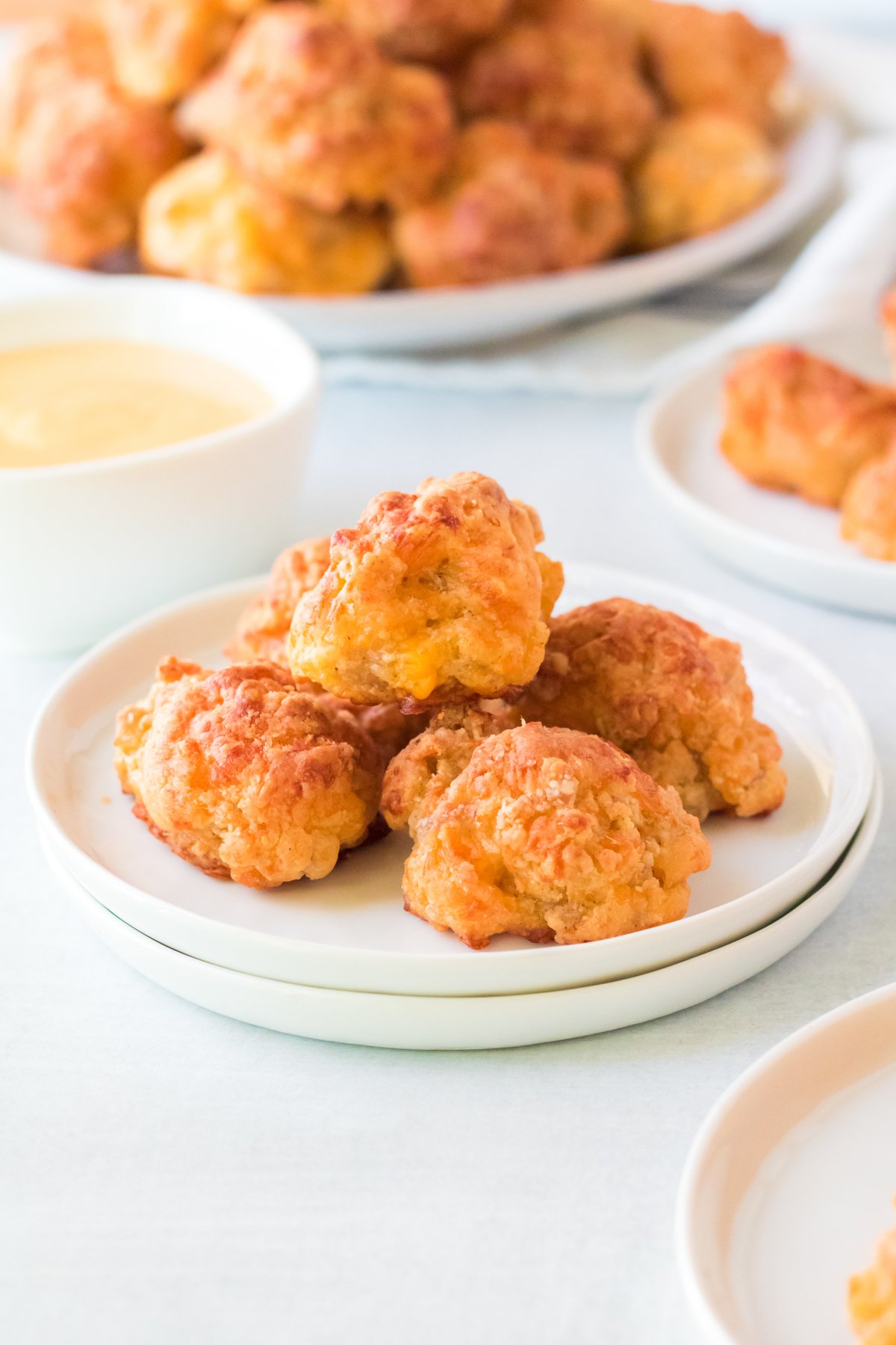 white plate with Bisquick sausage balls in a stack