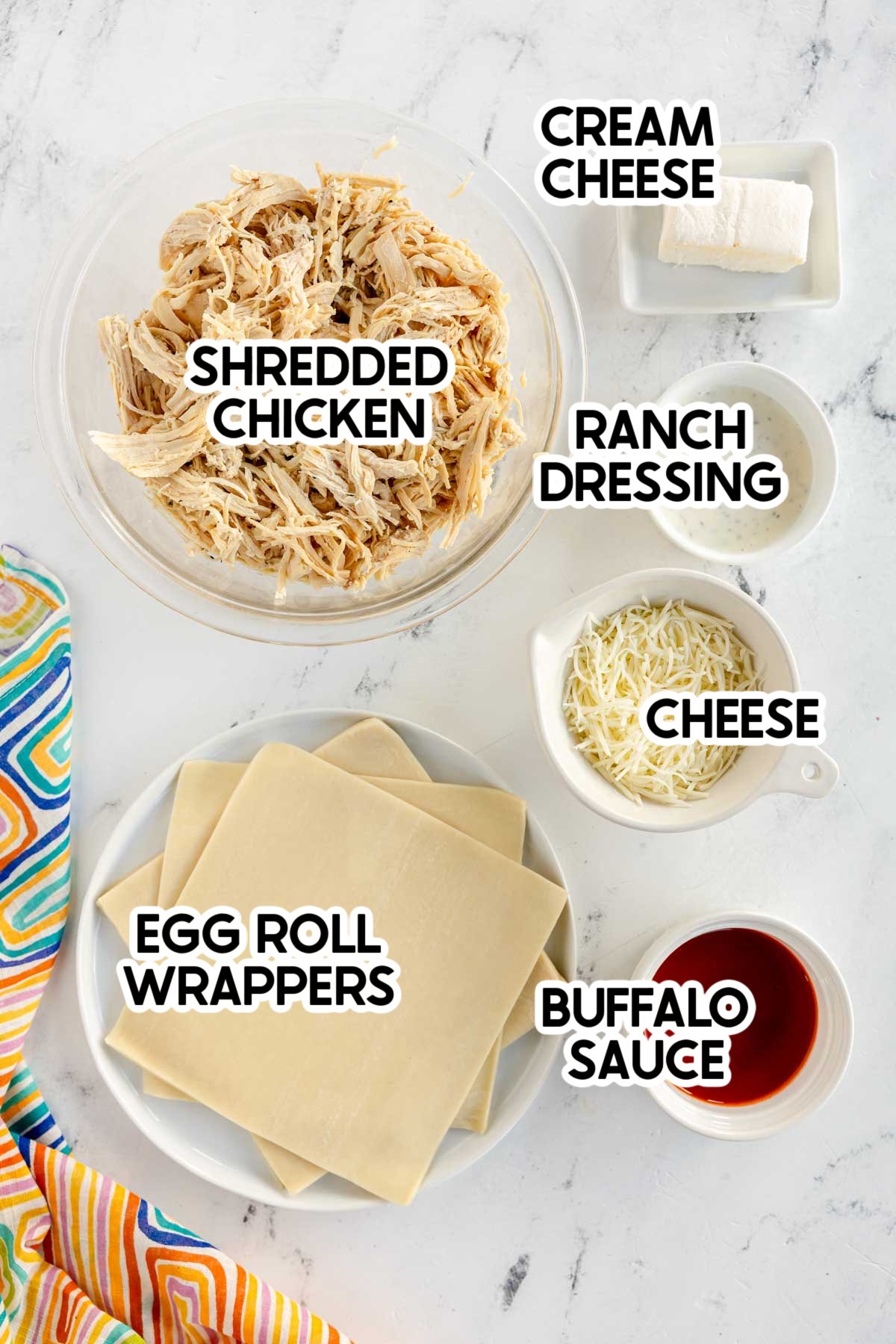 ingredients to make buffalo chicken egg rolls with labels