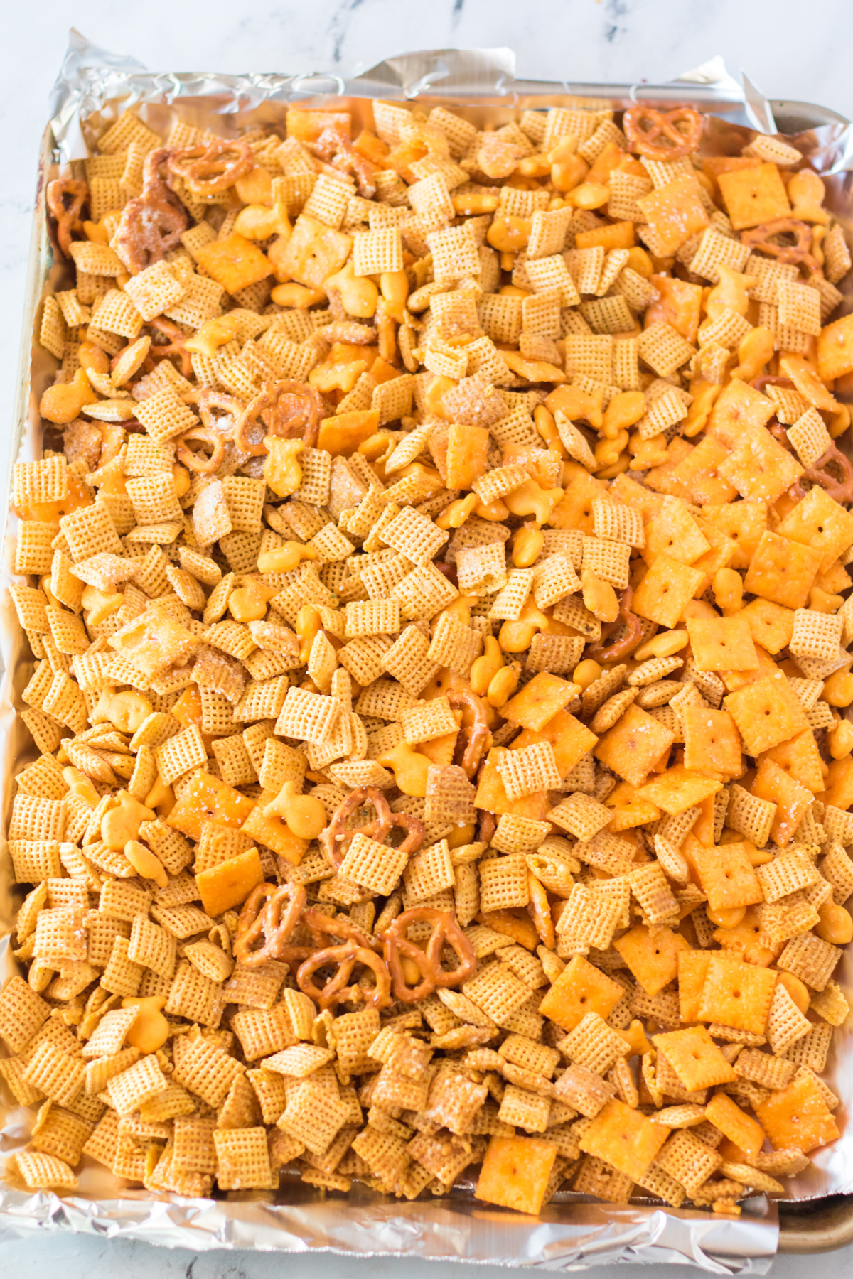 unbaked cheddar chex mix ready to be baked