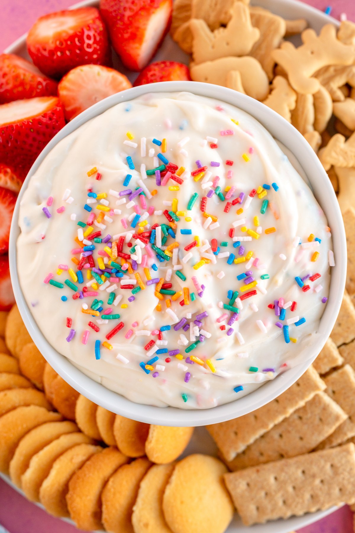 White bowl with funfetti dip and cookies