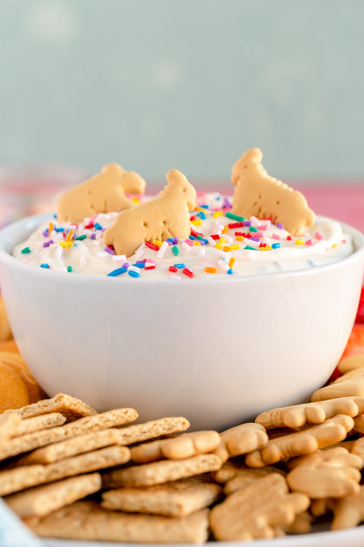 bowl of funfetti dip with animal crackers on top