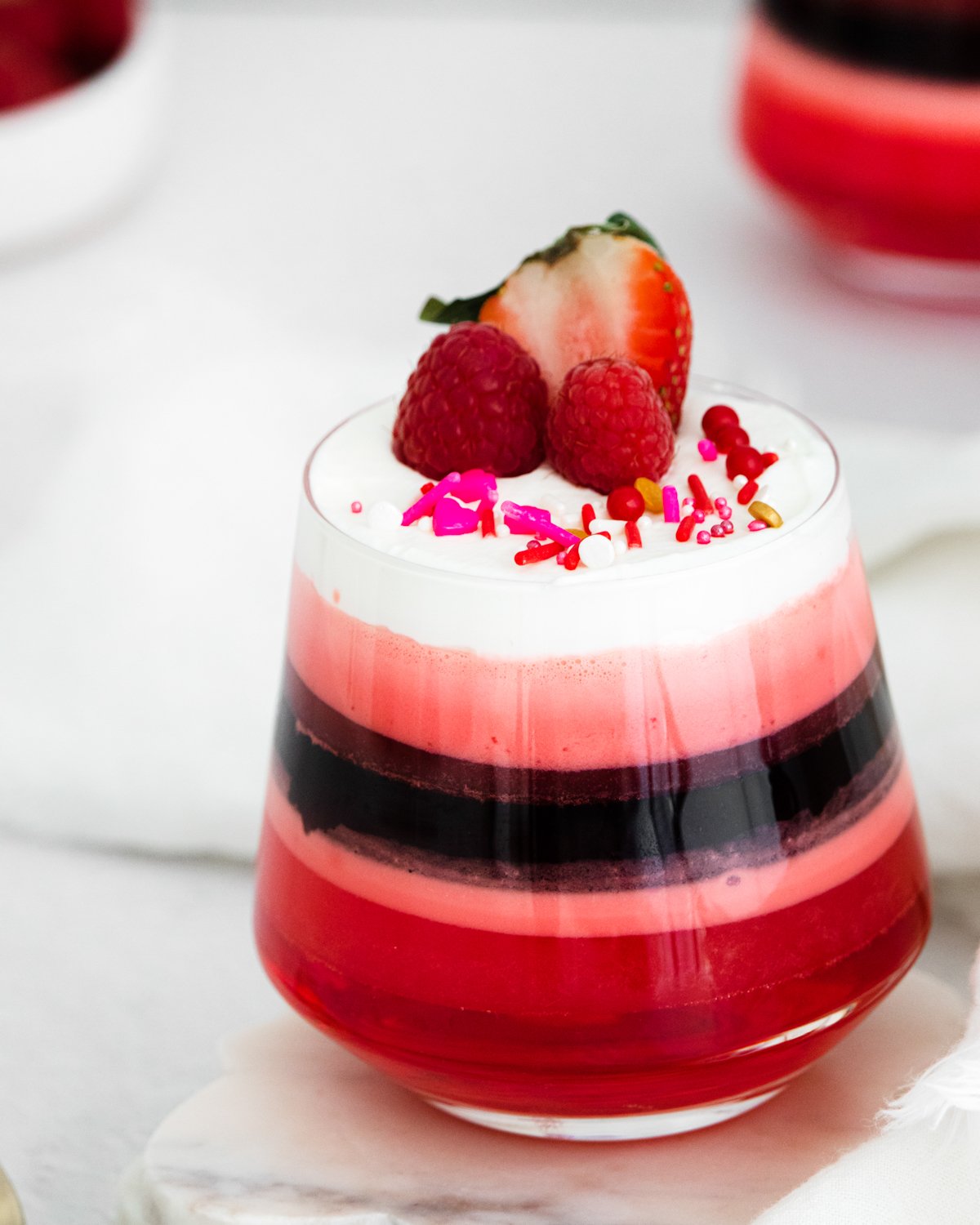 glass cup with layered jello dessert inside
