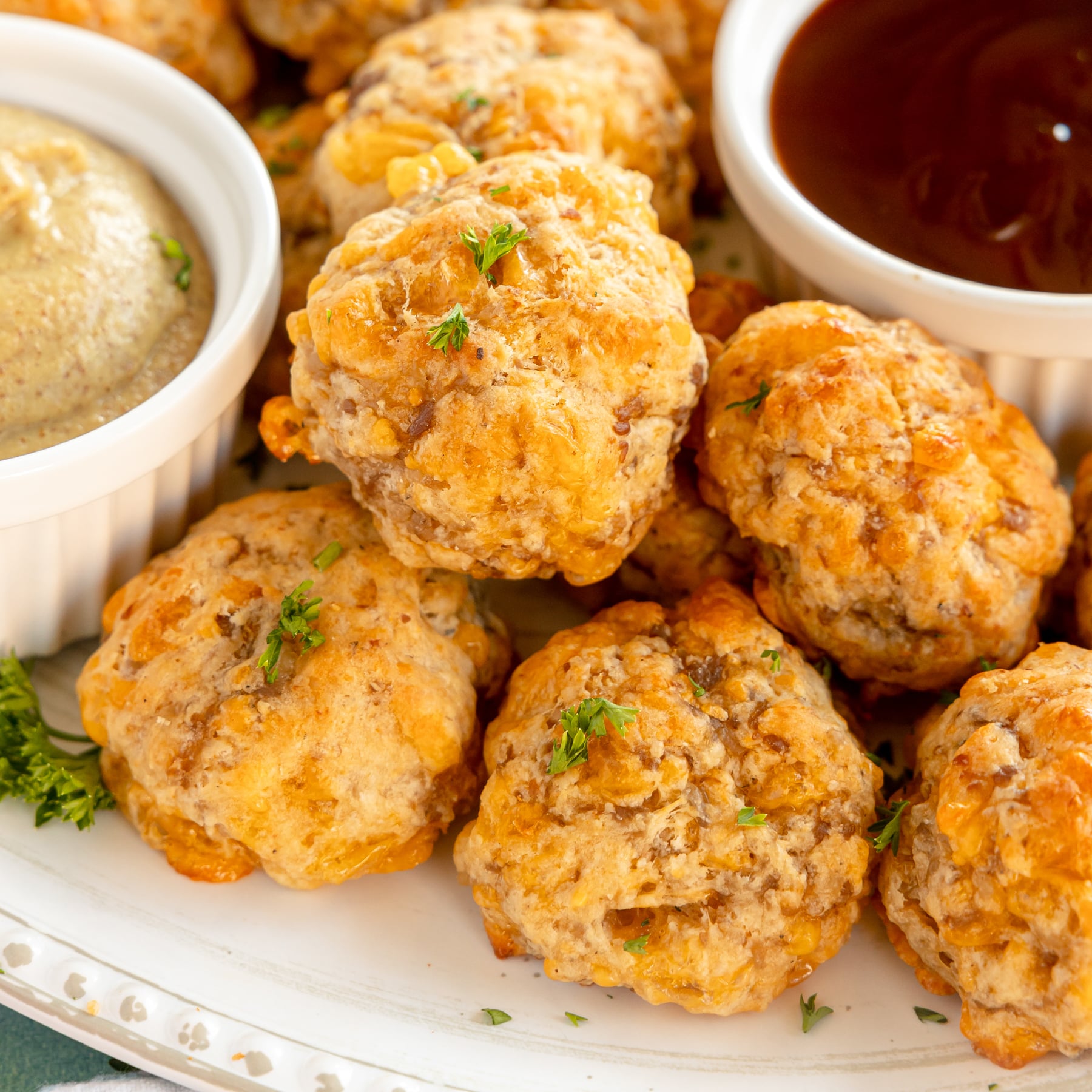 white plate with a pile of bisquick sausage balls
