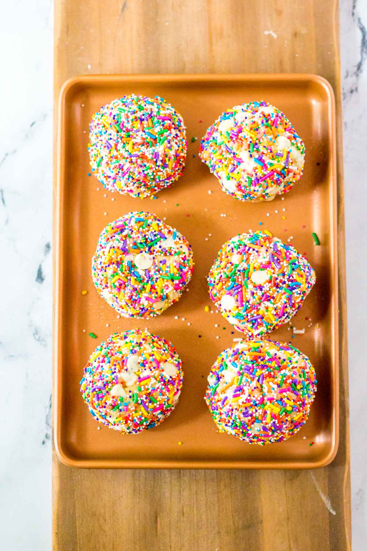 sprinkle cookies on a baking sheet