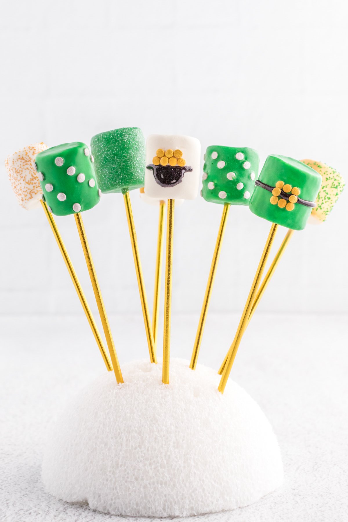 glittery green marshmallow pop on styrofoam