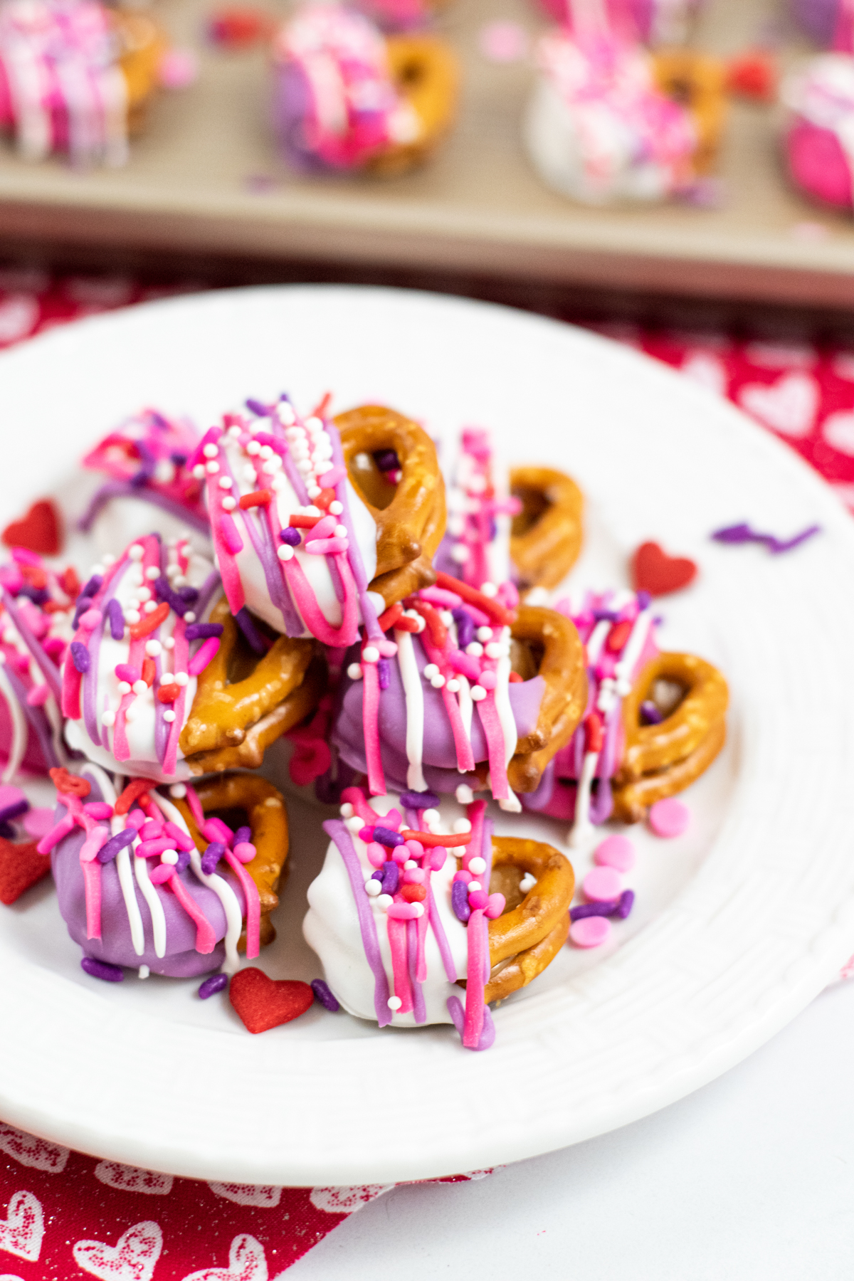 Valentine's Day pretzels stacked on a white plate