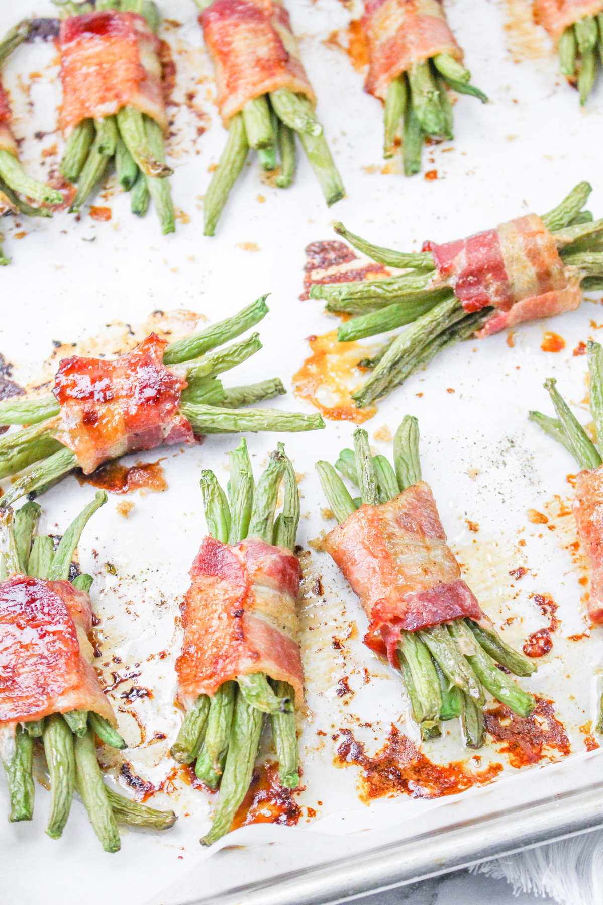 baking sheet with bacon wrapped green beans