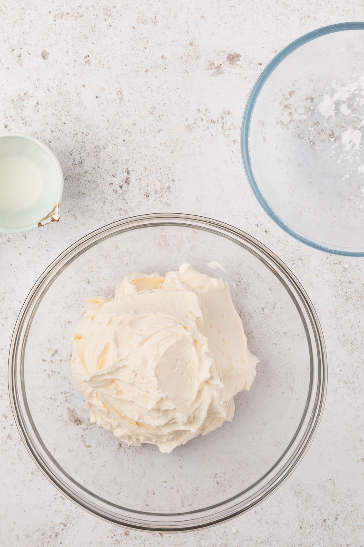 vanilla buttercream in a plastic bowl