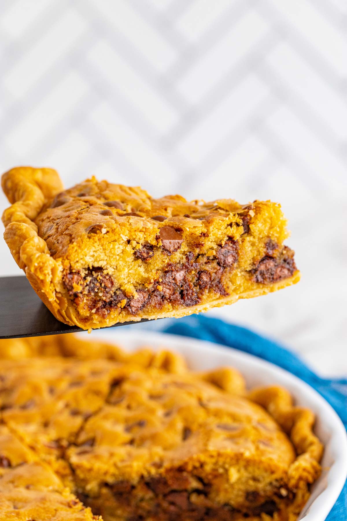 slice of chocolate chip cookie pie on a pie server