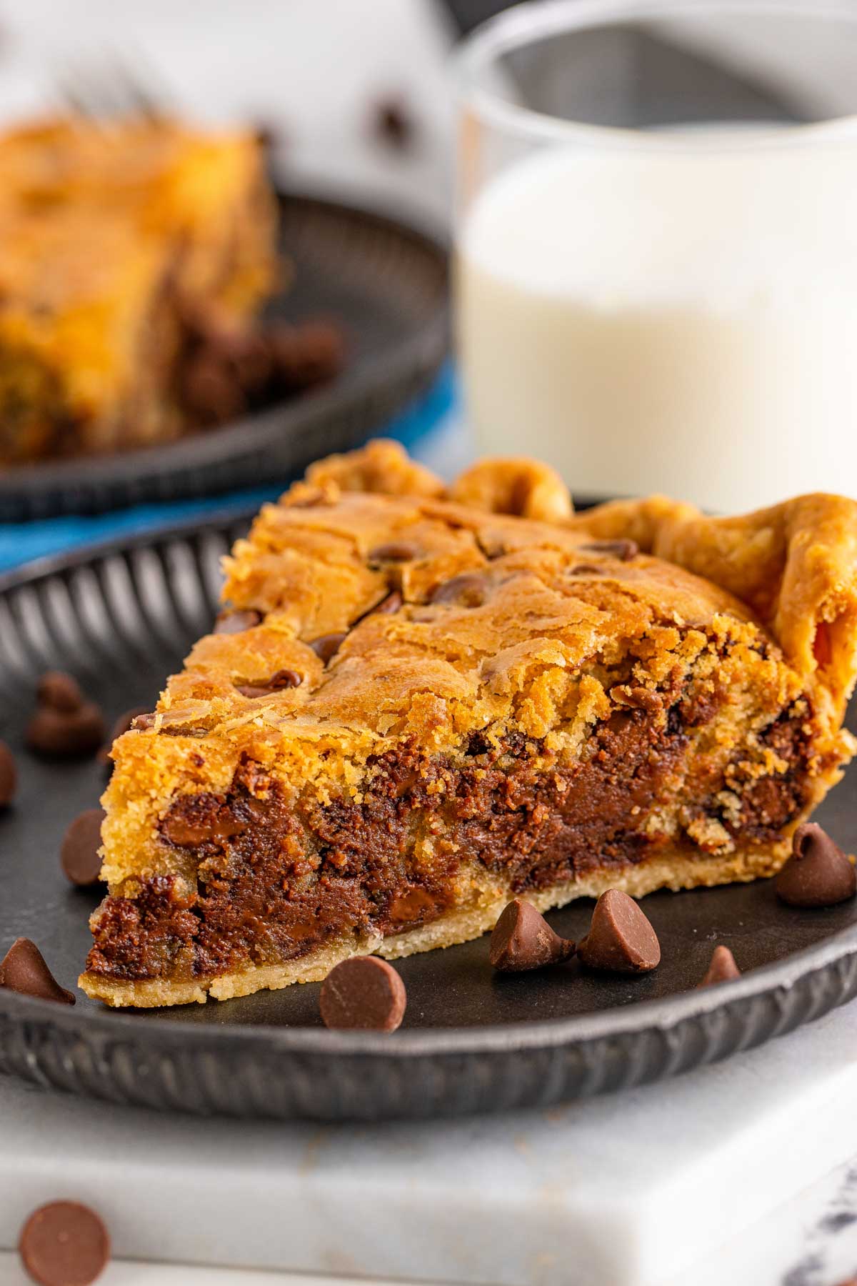 slice of chocolate chip cookie pie on a gray plate