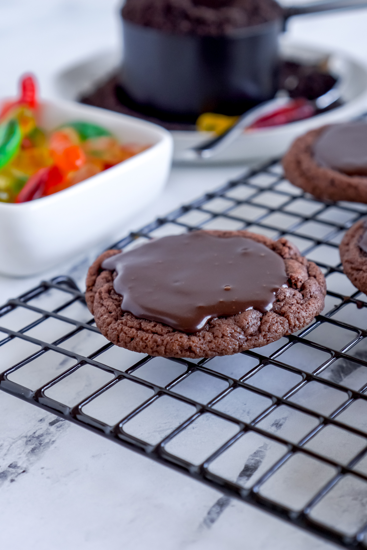 chocolate topped cookie on a cooling rack