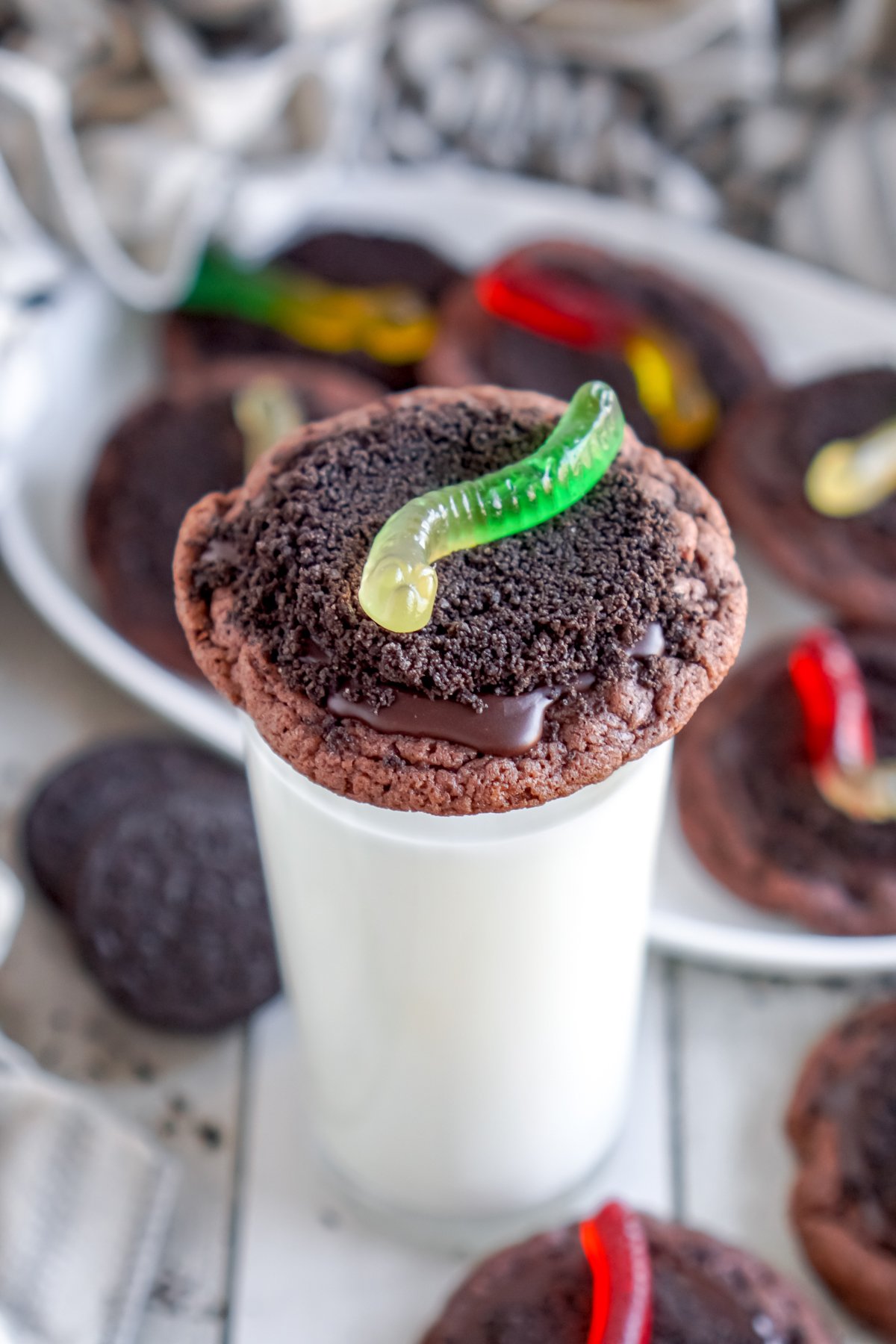 dirt cookies on top of cups of milk