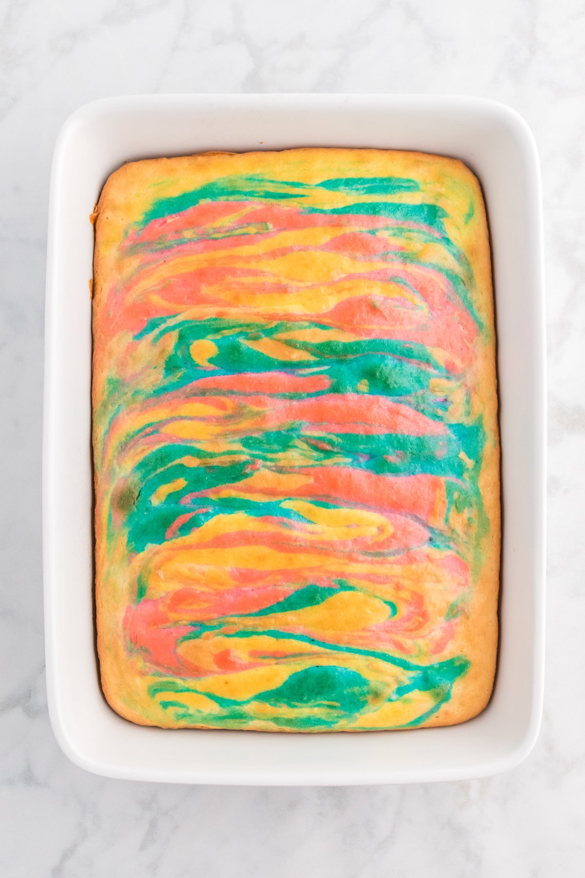 swirled Easter cake cooling in a baking dish