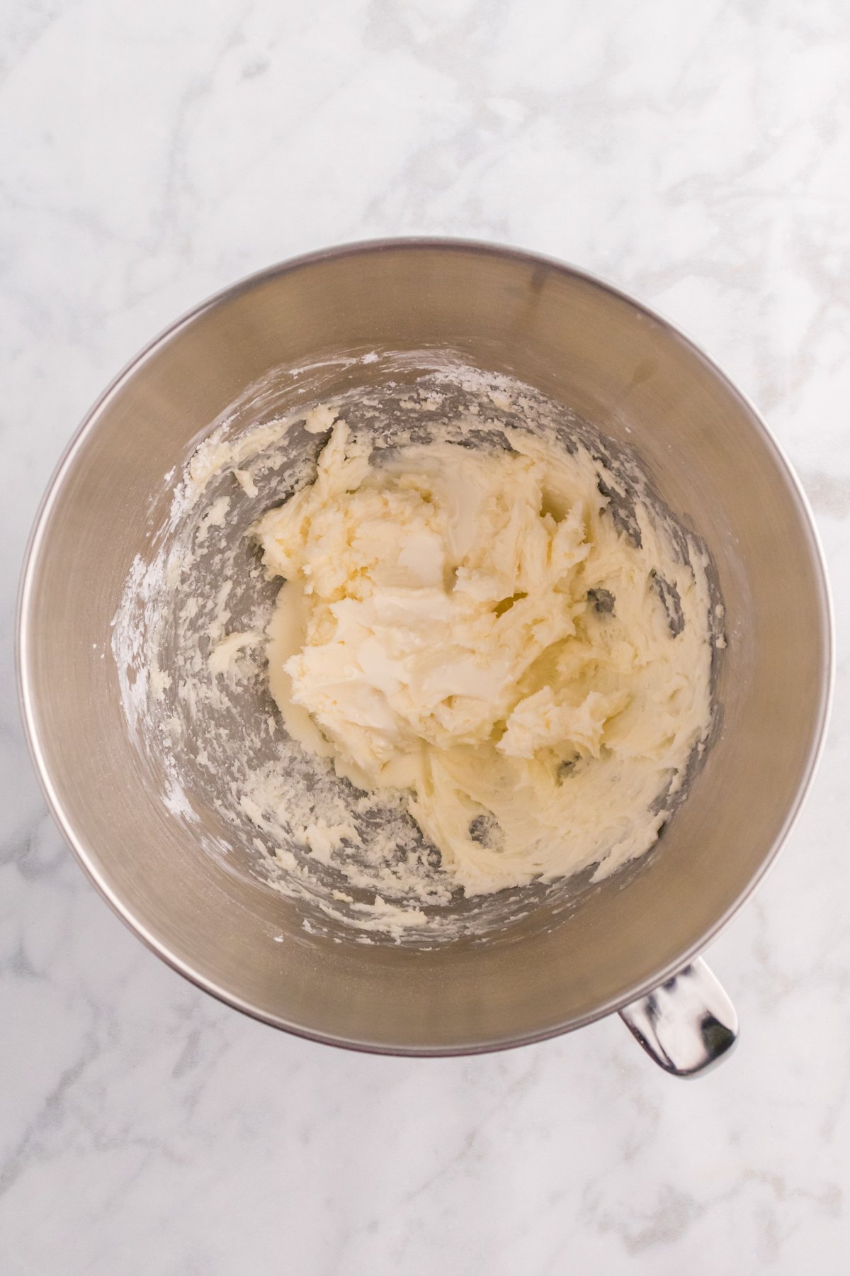 metal bowl with ingredients for frosting