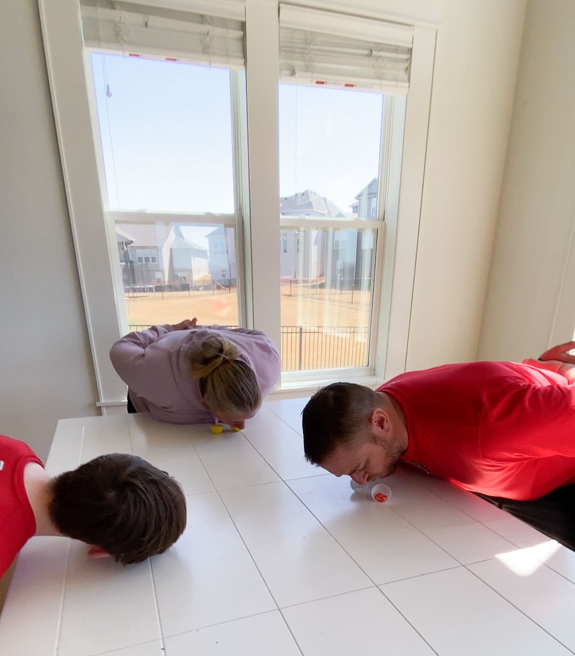 family playing Easter egg games on a table