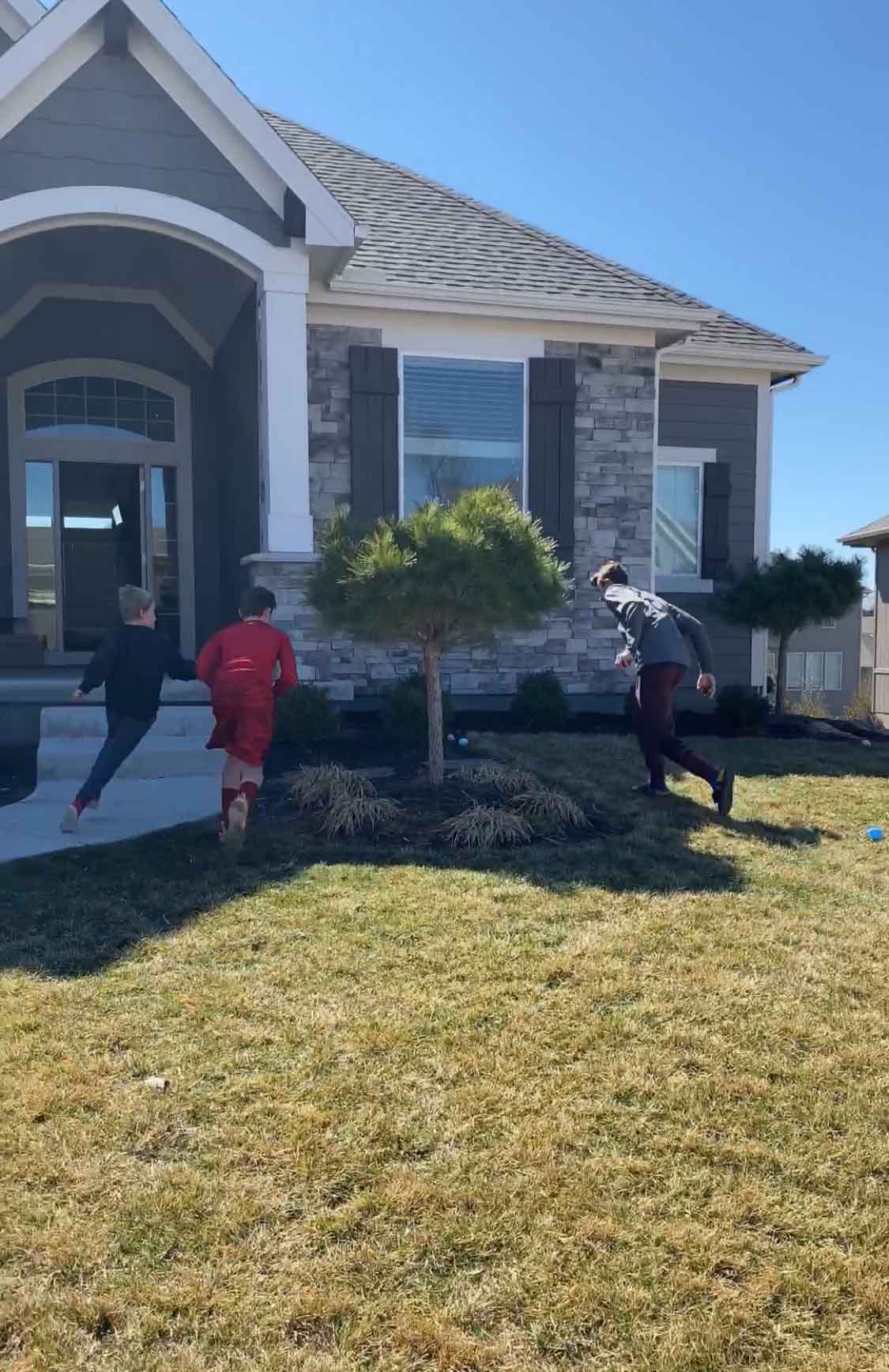 boys running to find Easter eggs