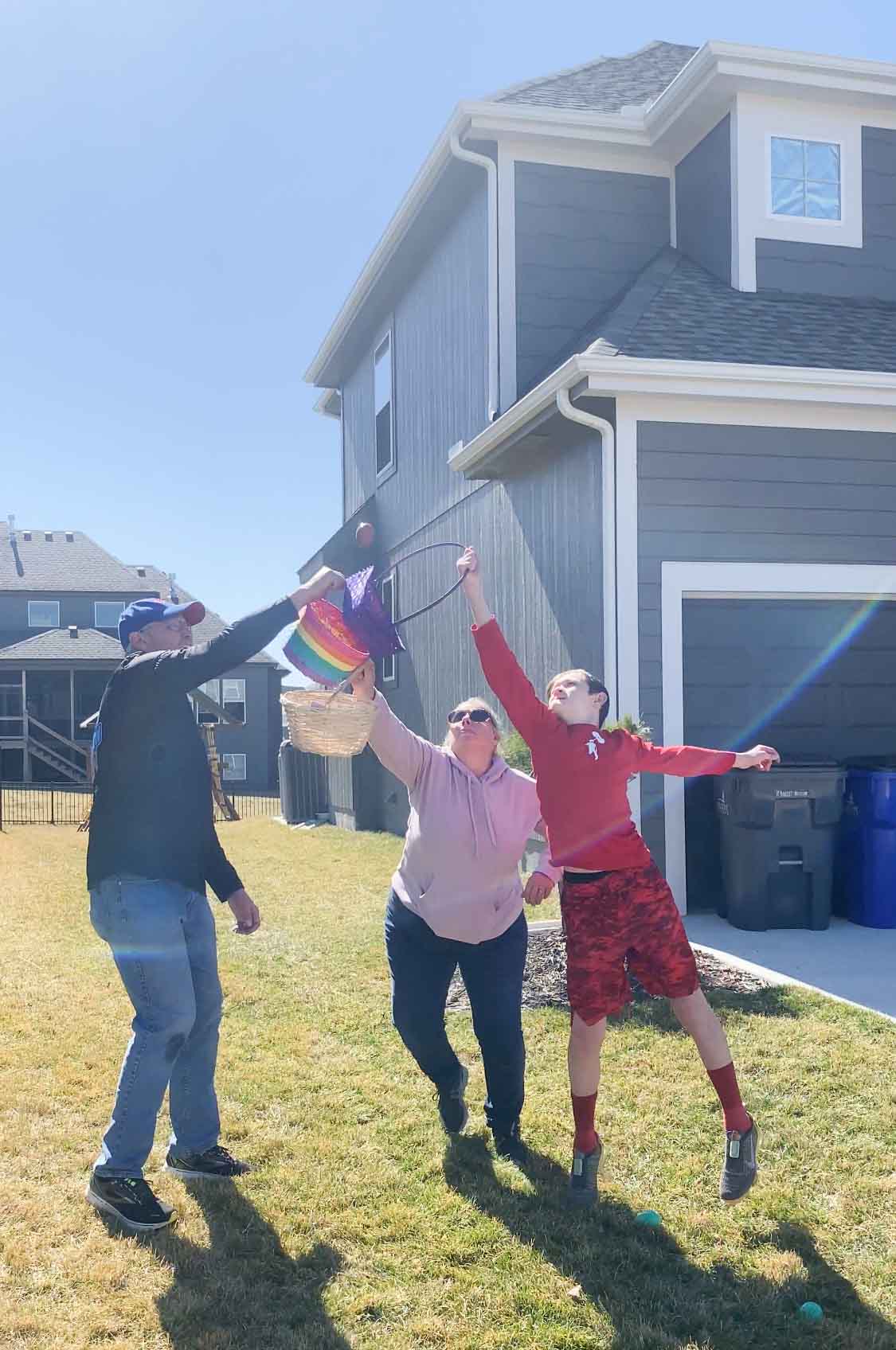 adults playing Easter games with Easter baskets