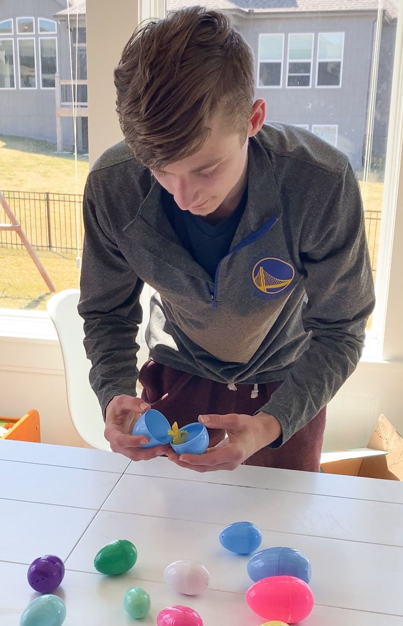 teen opening an Easter egg