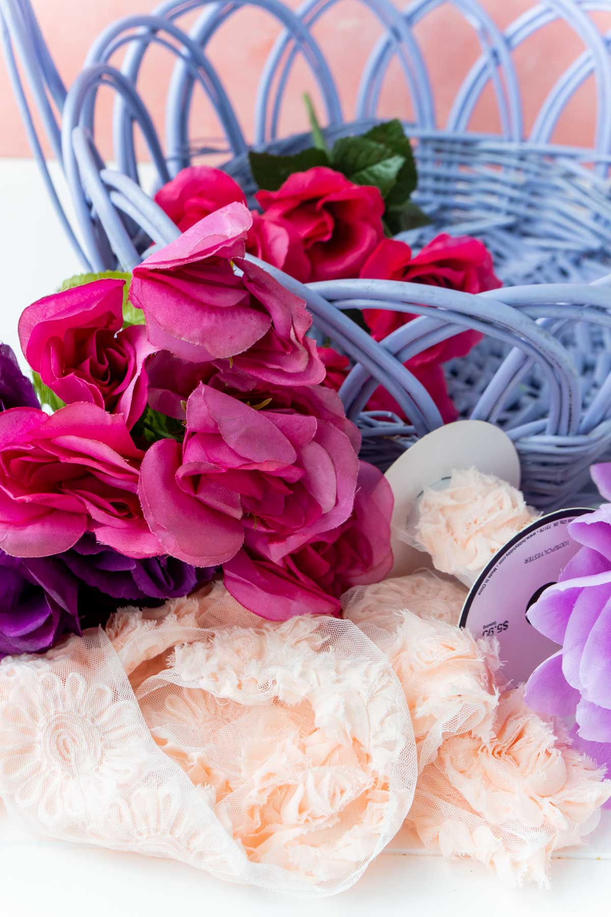 Flowers and rose ribbon by an Easter basket