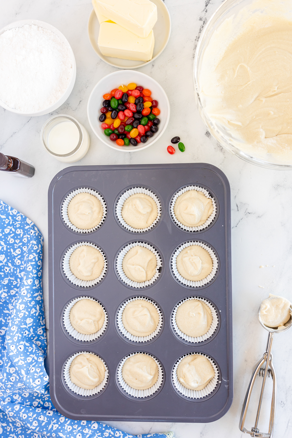 muffin tins with cupcake batter