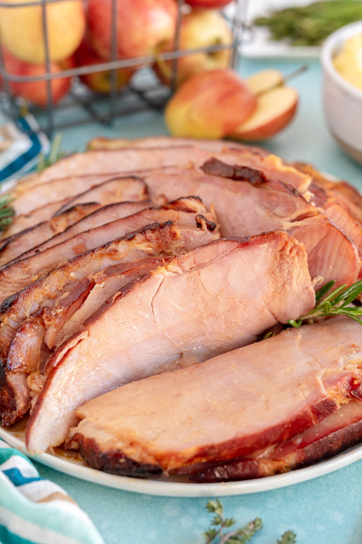 glazed ham sliced on a white plate