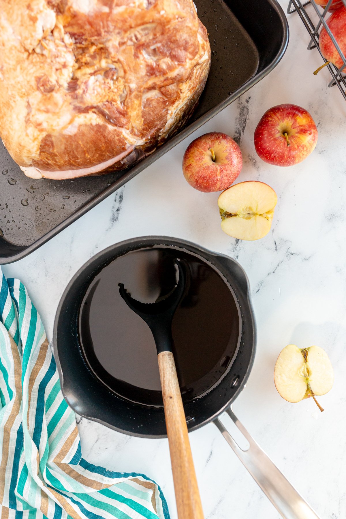 pot full of apple cider glaze for a ham